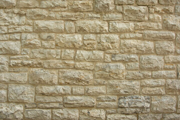 Yellow vintage stone brick wall texture. Basis background