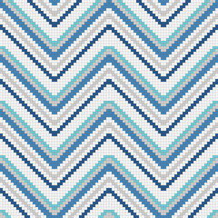 Pixelated chevron of blue and white mosaic cells. Vector decor suitable for print and decoration.