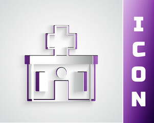 Obraz premium Paper cut Medical hospital building with cross icon isolated on grey background. Medical center. Health care. Paper art style. Vector