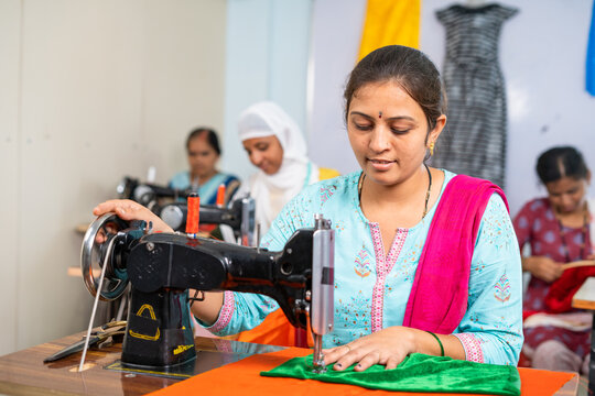 Garment Employees Busy Working With Cloth Sewing At Factory- Concept Of Hard Working, Self Employed And Small Business