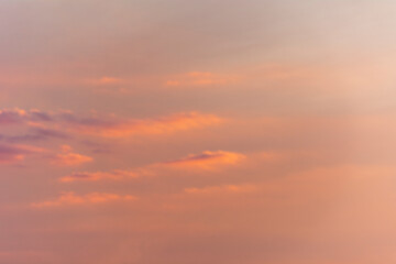 The setting sun in a colored sky.