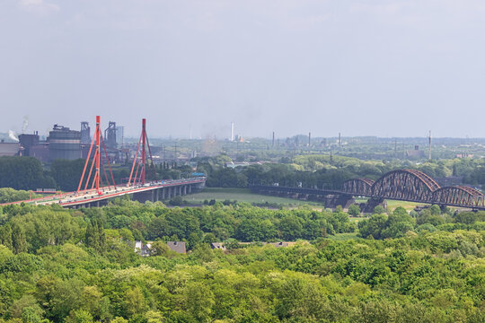 Highway and railway bridges over the Rhine, seen from the Halde Rheinpreussen with heavy industies around Duisburg