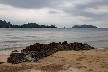 Rocks and beach by the sea and blurred background.
