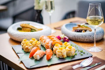 Rolgordijnen sushi and white wine outdoor © Maksim Shebeko