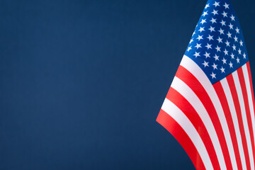 The flag of the United States of America on blue background with copy space