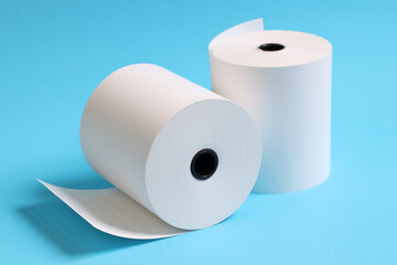 white paper rolls placed on a blue background