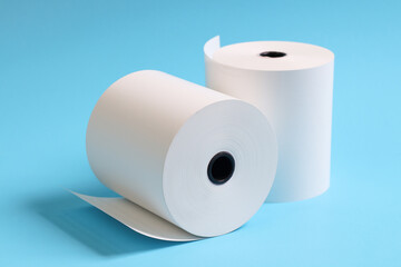 white paper rolls placed on a blue background