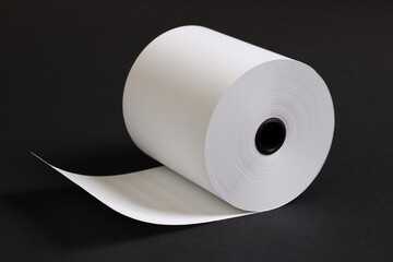 Rolls of white paper placed on a black background.