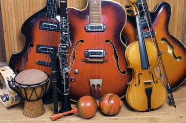 Fototapeta na wymiar Three jazz electric guitars, violin, clarinet, flute, djembe, maracas,