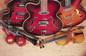Fototapeta na wymiar Three jazz electric guitars, violin, clarinet, flute, djembe, maracas,