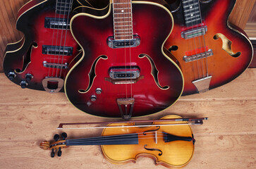 Fototapeta na wymiar Three jazz electric guitars, violin, 