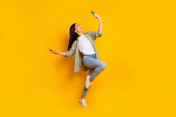 Fototapeta na wymiar Full body photo of pretty cheerful person hold use telephone take selfie isolated on yellow color background