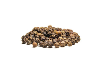 Black pepper isolated on white, a view of a pile of dried black pepper isolated on white background