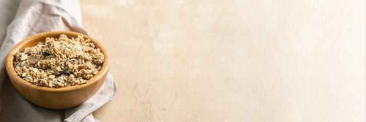 Homemade granola bowl with unprocessed whole grains, chia, quinoa, nuts, seeds with chocolate slices.Banner with copy space