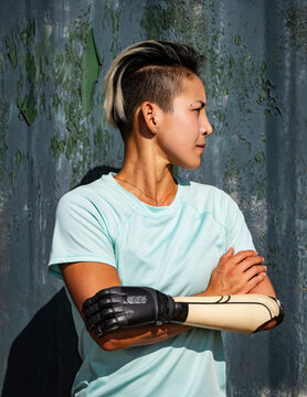 Portrait of athlete woman with prosthetic arm