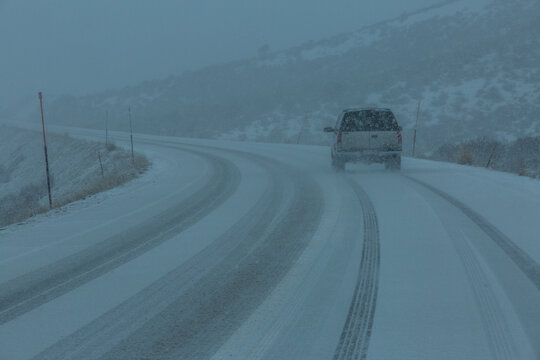 USA, Idaho, Fairfield, Pick-up&nbsp;truck on snow covered highway 20 in rural landscape