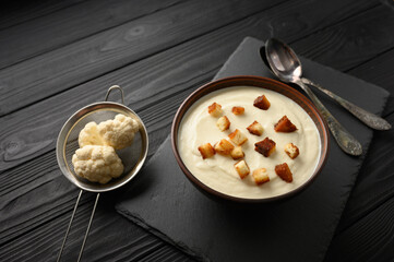 Creamy cauliflower soup with homemade croutons.