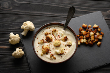 Creamy cauliflower soup with fried cauliflower and croutons.