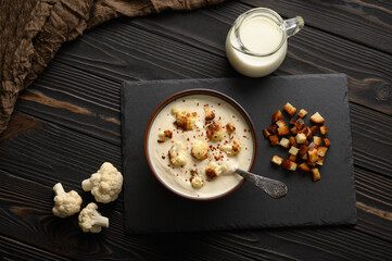 Creamy cauliflower soup with fried cauliflower and croutons.