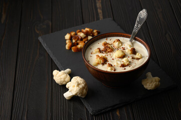 Creamy cauliflower soup with fried cauliflower and croutons.