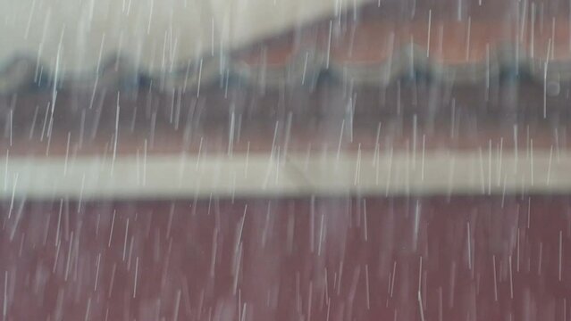 In the rainy season, it rains from the roof of a wooden house. Macro Video Slow Motion.