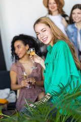 Young women at swap home party - clothes, shoes, bags, jewellery exchange between friends. Zero waste shopping, eco friendly concept, sustainable lifestyle. College life.
