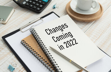 A text Changes Coming in 2022 written on a notepad showing the changes that will occur in 2022