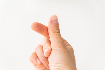 A hand signs gesture to be little heart from tip of thumb and index finger on white background