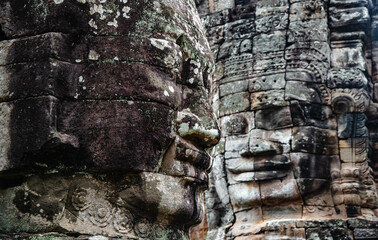 A large figure carved face on sandstone in the pagoda of Bayon Angkor Thom Temple, Siem Reap,...