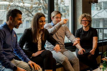 Having a great time together in the cafe while smiling