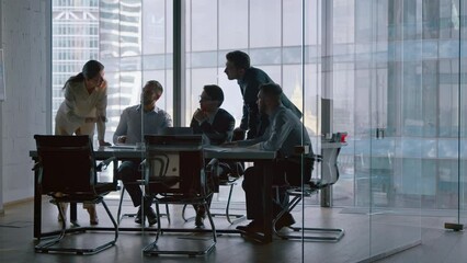 Corporate teamwork in the middle of a working day in a workplace