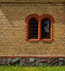 Fototapeta na wymiar Architectural details of the Catholic Church of Our Lady of the Rosary built in 1895 in the neo-Gothic style in Bajtkowo in Masuria, Poland.
