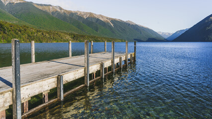 Wooden dock over the water in Nelson Lakes National Park in New Zealand