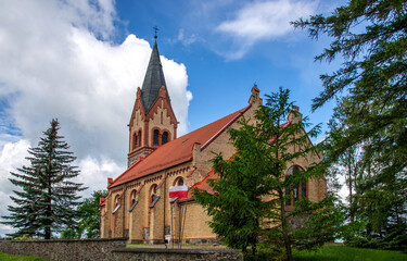 Fototapeta na wymiar Built in 1895 in the neo-Gothic style, the Catholic Church of Our Lady of the Rosary in Bajtkowo in Masuria, Poland.
