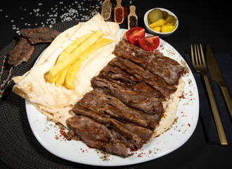Doner kebab in lavash bread isolated on white.