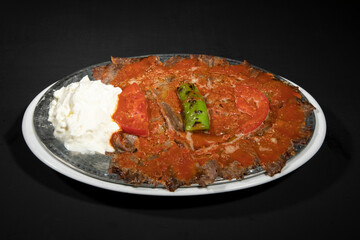 İskender Döner / Traditional Turkish Dishes with Yoghurt on a White Plate.