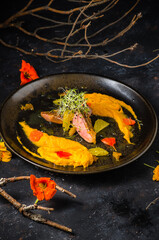 Asian-style duck breast with ginger-carrot puree and orange sauce