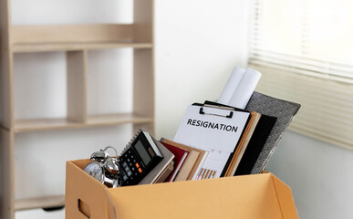 Resignation, resignation letter and personal cardboard boxes The concept of dismissal and...
