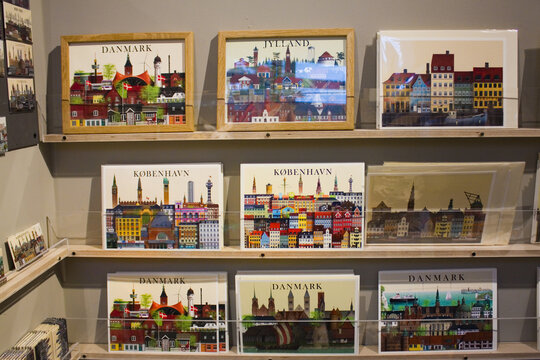 Souvenirs postcards with symbols of Denmark for sale at showcase in Copenhagen