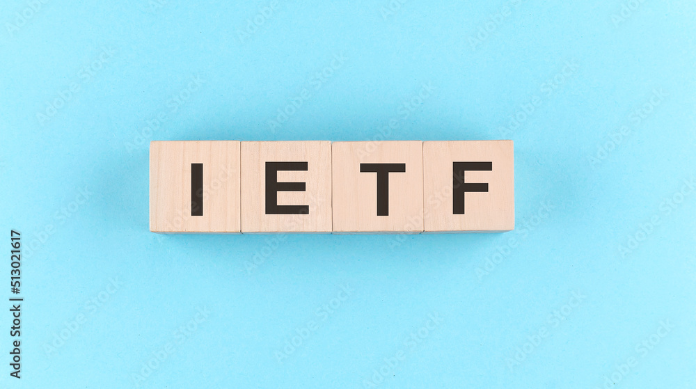 Aufkleber wooden cube block with text ietf internet engineering task force on the blue background