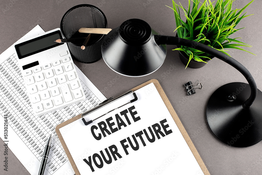 Aufkleber clipboard ,chart and calculator, lamp and workspace accessories on a grey table. top view , text cre