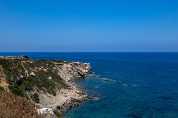 Fototapeta na wymiar Looking out over the rocky coastline on the northern side of the Karpas peninsula in Cyprus