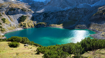 Fototapeta na wymiar closeup of blue-green lake Drachensee, hiking destination Ehrwald