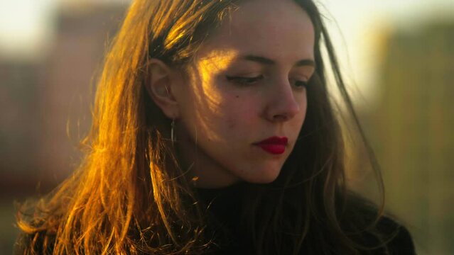 sad young woman on the terrace distressed by negative thoughts