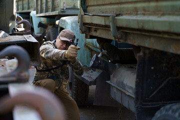 Defensive tactics shooter course, man with a gun in military uniform. Tactical training course...
