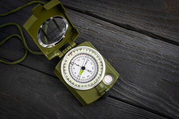 Nice military magnetic Compass. On black background. Army magnetic compass