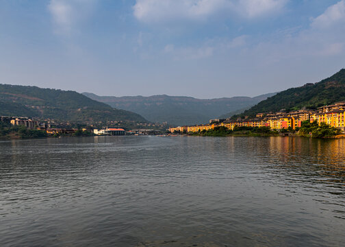 Beautiful view of the Lavasa city on the shore of the lake in India with hills in the background