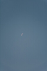 moon view during a blue sky afternoon