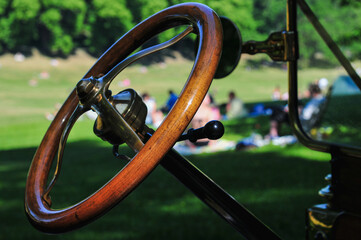 Closeup shot of a steering wheel of an antique car