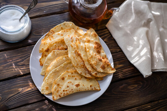 Traditional Karelian sweet pies for son in law. Thin crispy cakes with sugar inside. Traditional matchmaking Karelian ritual pies